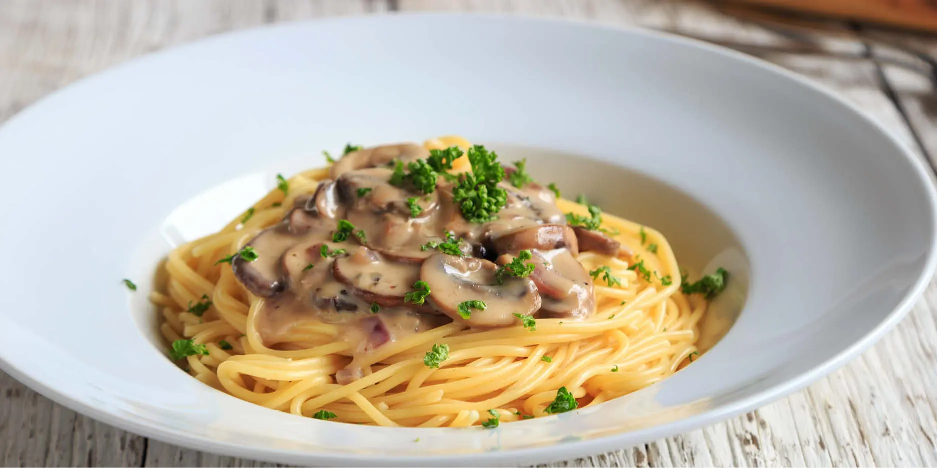 Spaghetti an Pilzrahmsauce